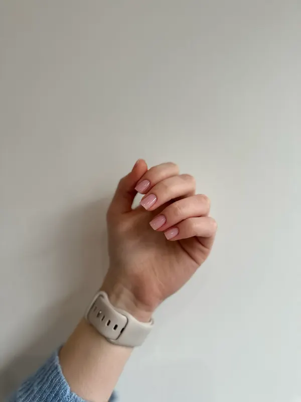 Short square nails in a sheer soft pink