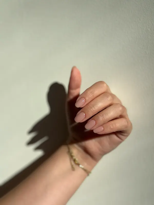 Short rounded nails in a milky nude