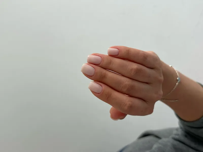 Short square nails in a natural nude