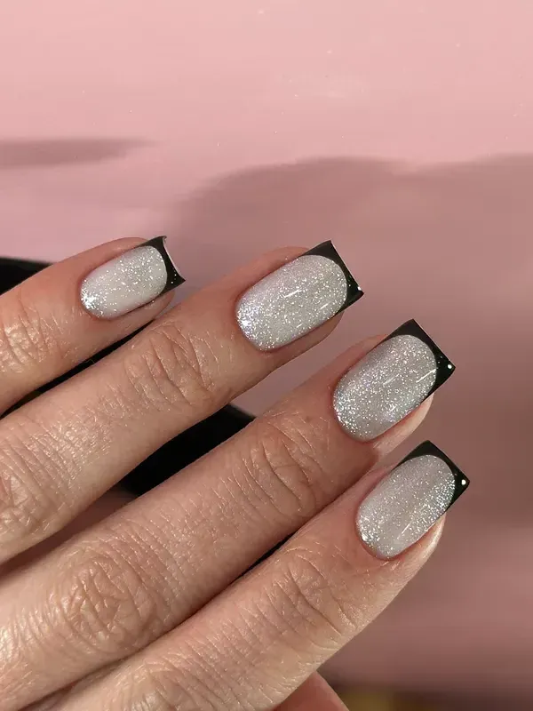 Square nails in silver glitter with black French tips